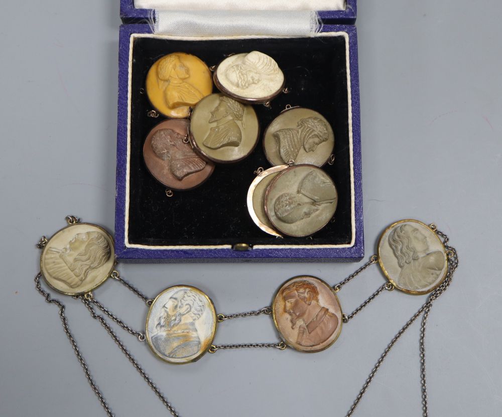 A 19th century gilt metal and oval lava panel set necklace and six other oval lava panels, all carved with busts.